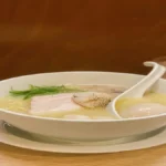 Bowl of chicken soup natural expectorant and immunity‑boosting food.
