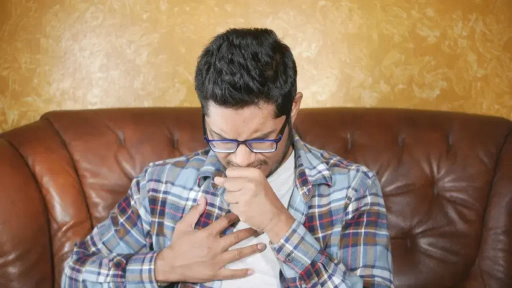 Cough syrup bottles containing DXM warning about abuse risk.