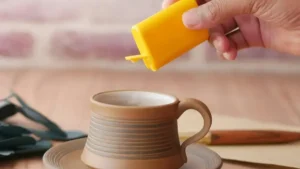 Aspartame sweetener evaluating carcinogenic potential and safe intake.