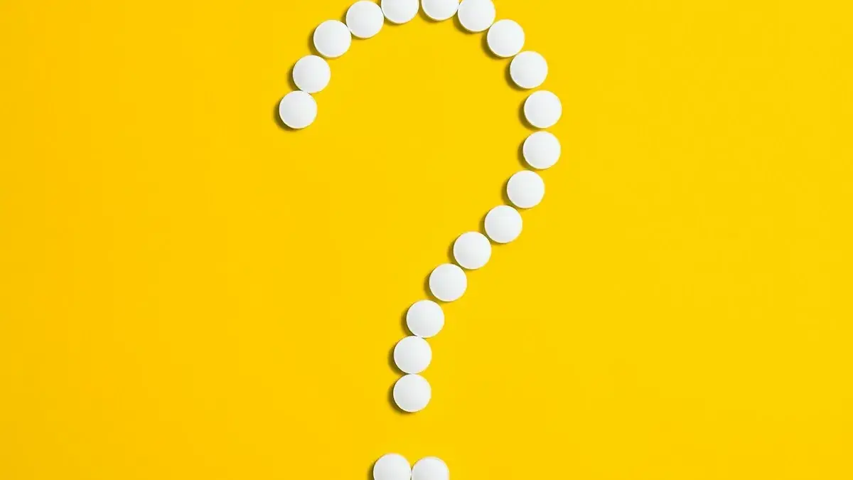 Paracetamol tablet and safety concept illustrating benefits and risks.