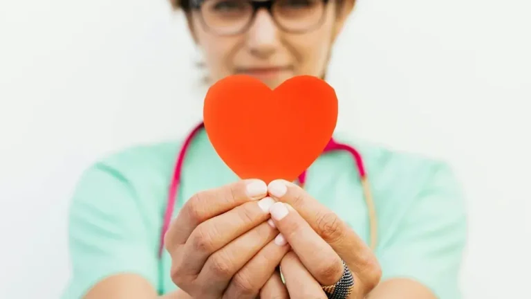 Healthy foods fish, leafy greens, nuts representing diet for heart and menopause health.