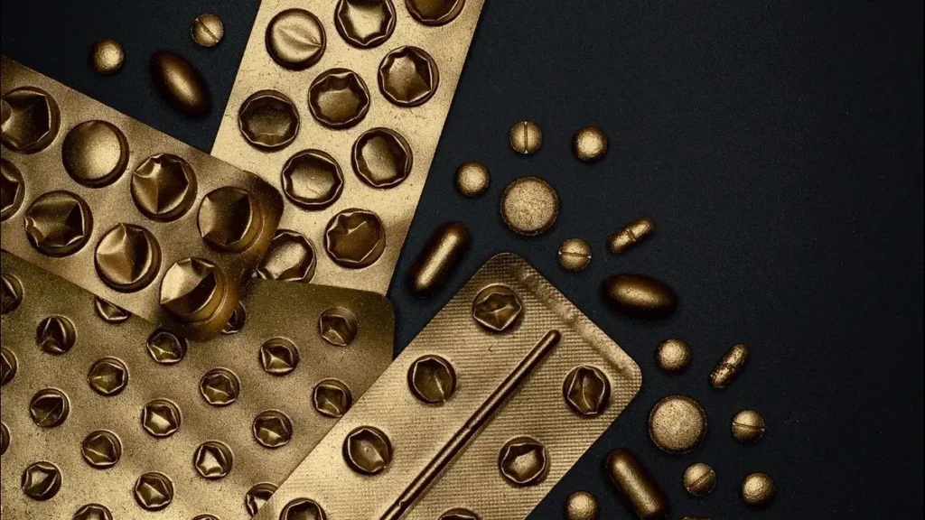 Graphic showing iron pills and a DNA strand overlaid with a cancer cell — representing excess iron and cancer risk.