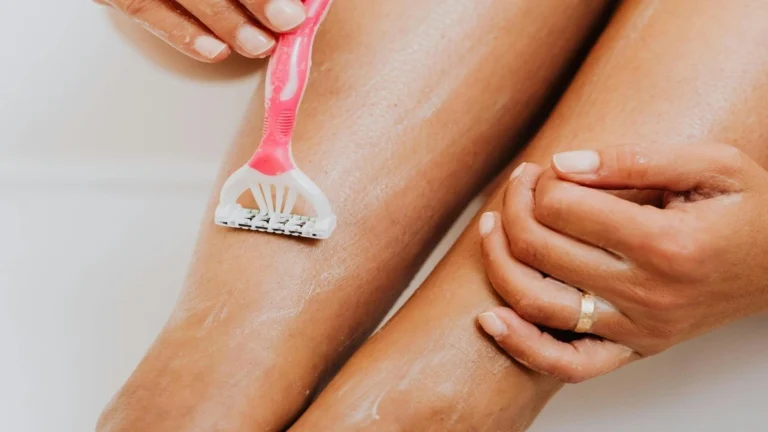 Natural ingredients (like oil/botanicals) around a silhouette of a human body symbolizing skin, hair and body care.