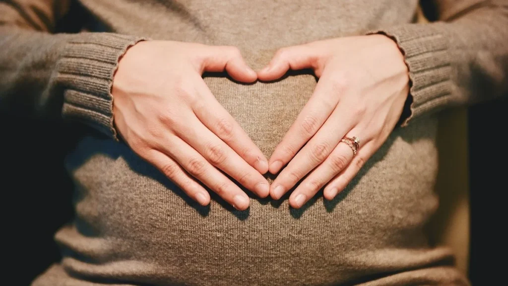 Various potassium‑rich fruits (banana, avocado, orange, kiwi, pomegranate) ideal for pregnancy nutrition.