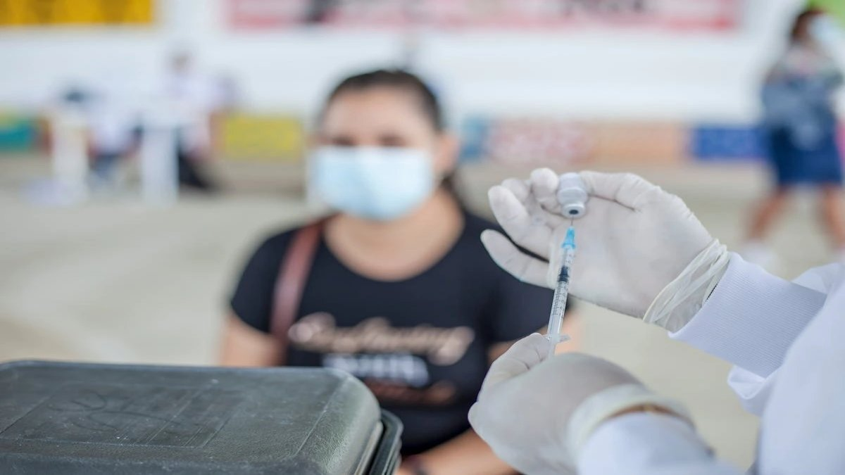Metformin pills on a table with Long COVID concept in the background