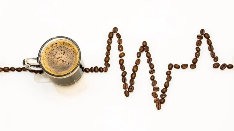 Coffee cup with roasted beans representing glucose control benefits