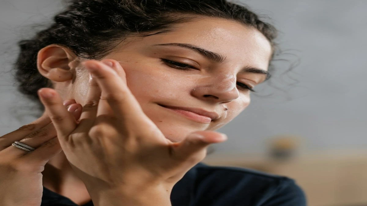 Dermatologist examining facial skin with illustration of collagen fibers beneath the skin layers