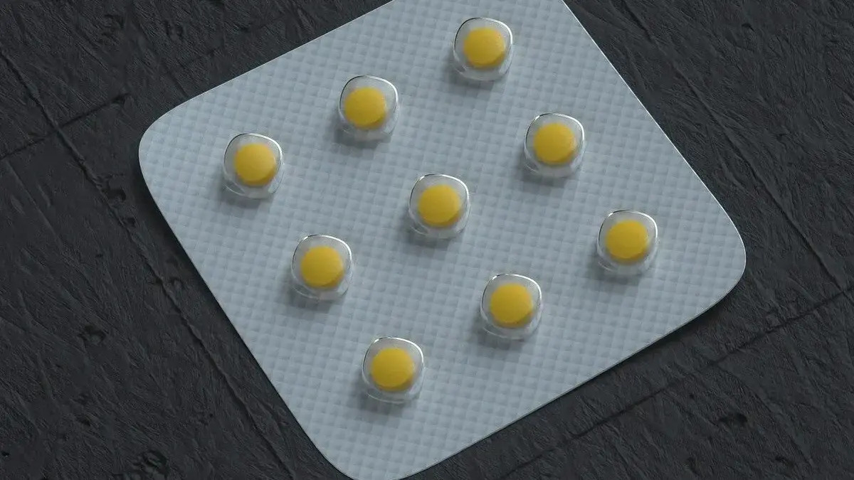 Close‑up image of a folic acid supplement bottle and capsules representing unmetabolized folic acid in the bloodstream.