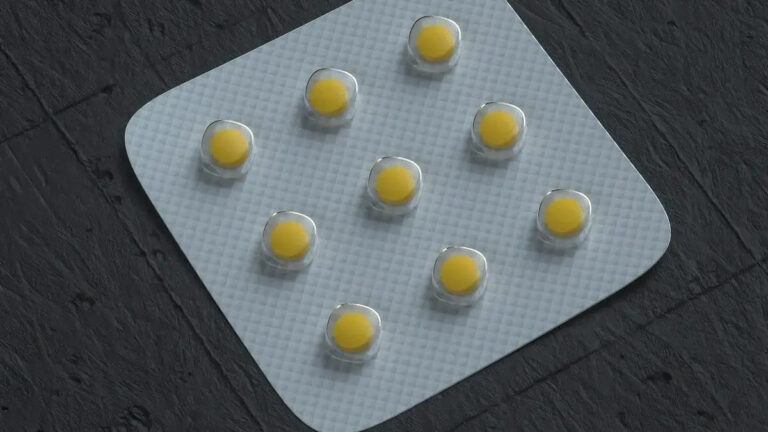 Close‑up image of a folic acid supplement bottle and capsules representing unmetabolized folic acid in the bloodstream.