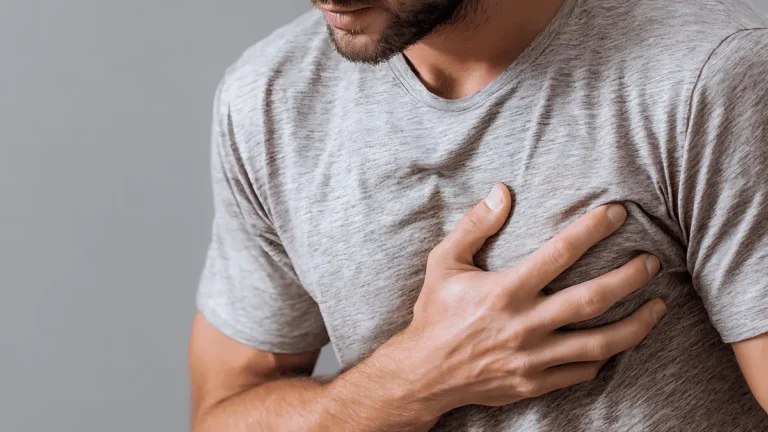 Stethoscope placed on red heart model symbolizing early signs of heart disease and cardiovascular health awareness.