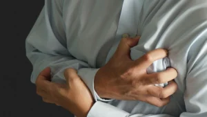 Person stressed at work, representing high cortisol and heart palpitations