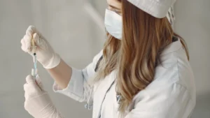 Syringe with peptide vial in laboratory setting representing unapproved wellness peptide injections