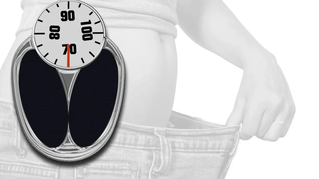 Doctor explaining GLP-1 weight loss treatment to patient in clinical consultation