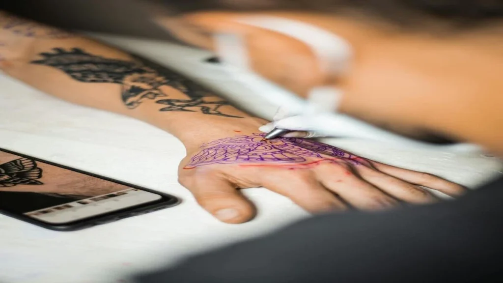 Tattoo needle injecting ink into skin triggering immune response