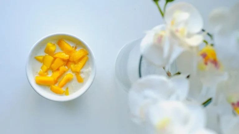 Mango cubes mixed with plain yogurt in a bowl for a healthy diabetes-friendly snack