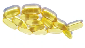 Fish oil capsules and omega-3 supplements representing new research on EPA and brain recovery after repeated head injuries.