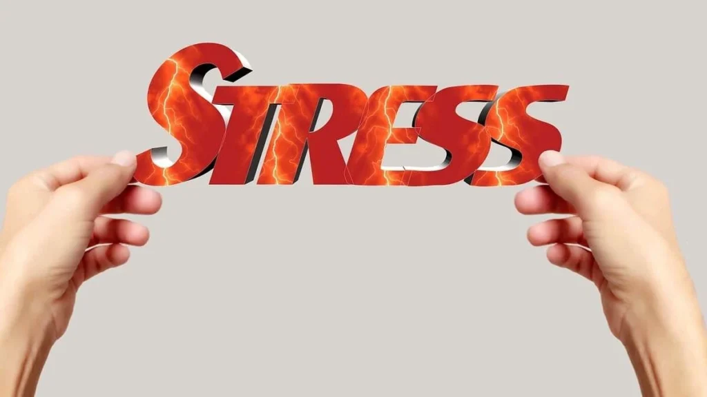 Person experiencing chronic stress and weight gain, illustrating how elevated cortisol contributes to belly fat, cravings, and metabolic changes.