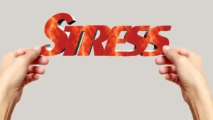 Person experiencing chronic stress and weight gain, illustrating how elevated cortisol contributes to belly fat, cravings, and metabolic changes.