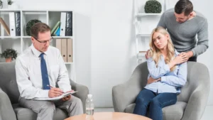 Person discussing symptoms with a mental health professional during a clinical assessment for diagnosis and support