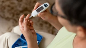 Person holding diabetes injection pen representing Ozempic vs Mounjaro (semaglutide vs tirzepatide) comparison for weight loss and blood sugar control.