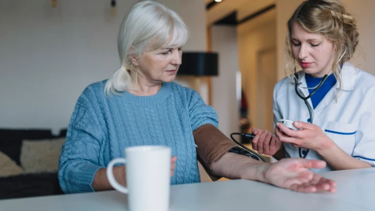 Woman checking blood pressure after skipping breakfast at home