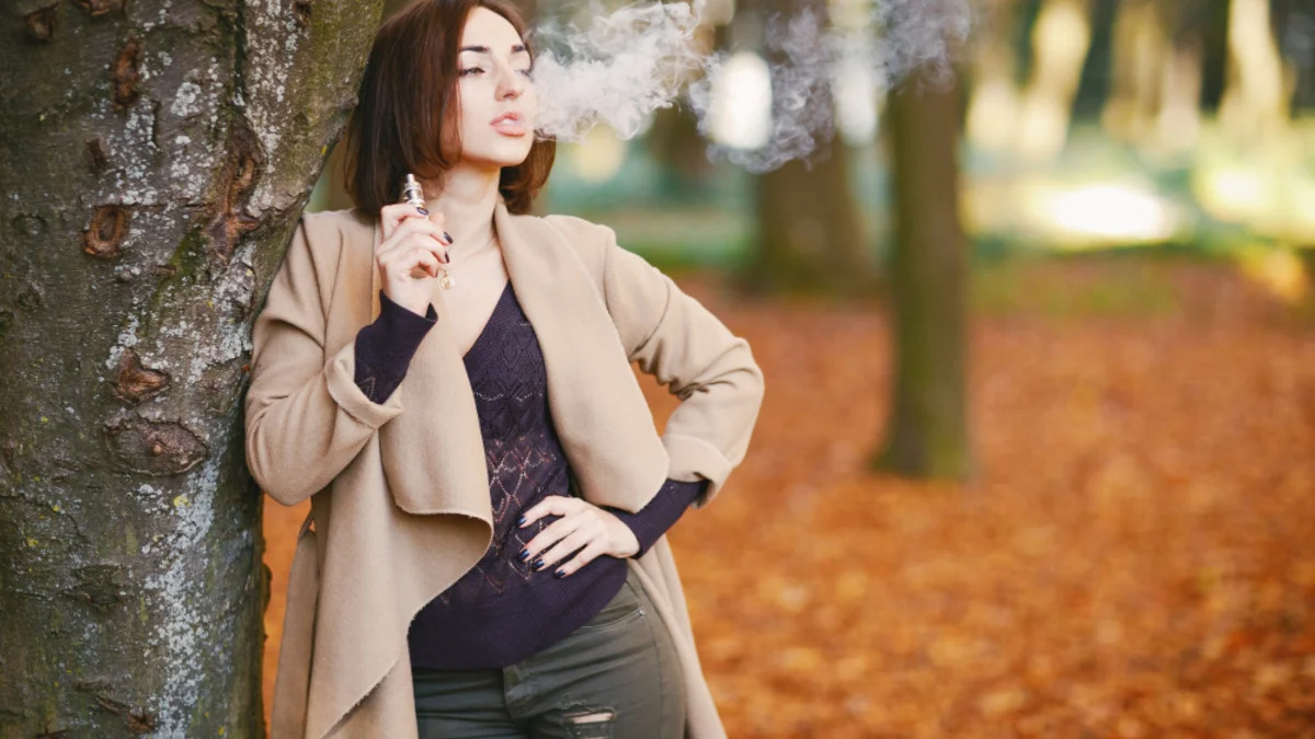 Pregnant woman avoiding vape device showing vaping during pregnancy risks