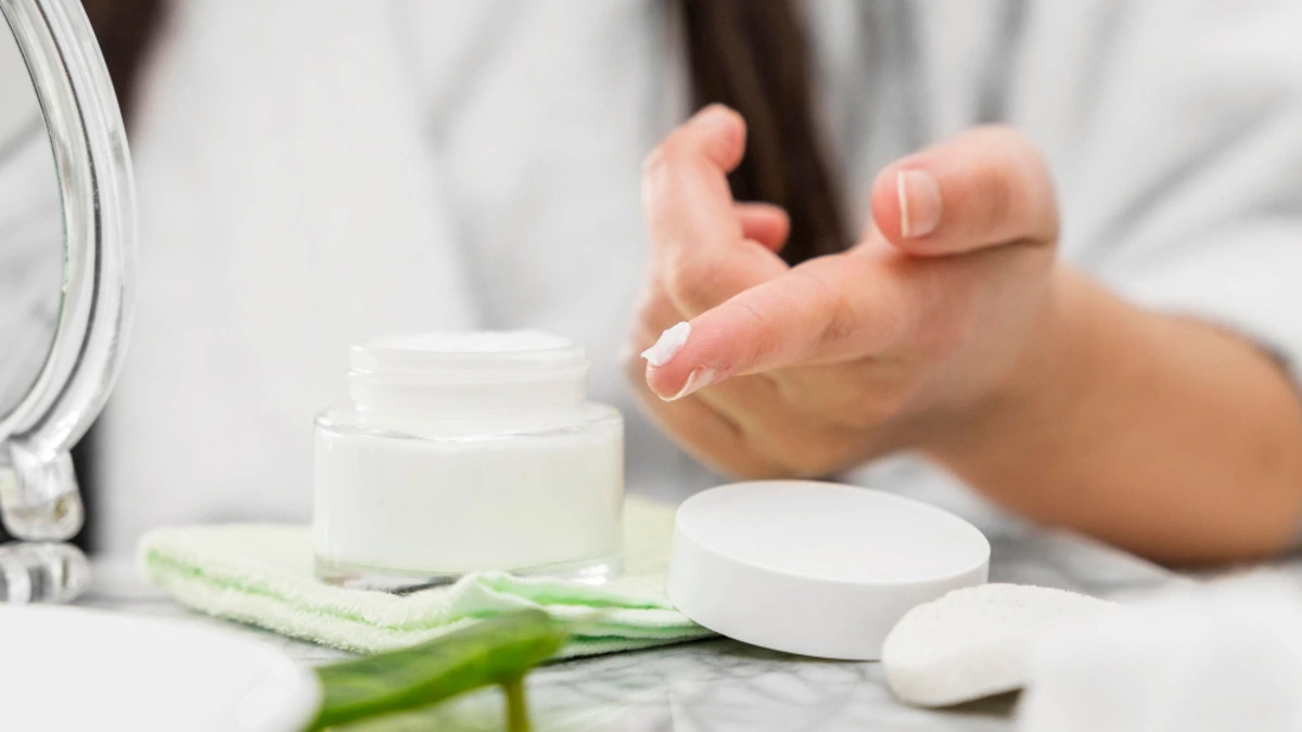 Pharmacist applying fragrance-free ceramide moisturizer to eczema-affected skin
