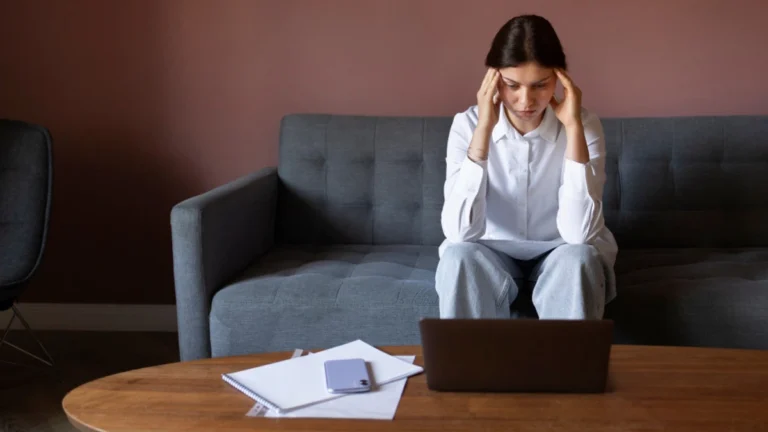 Person experiencing emotional exhaustion while comparing burnout vs depression symptoms