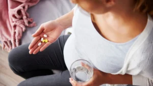 Pregnant woman discussing mental health medication safety with a healthcare professional