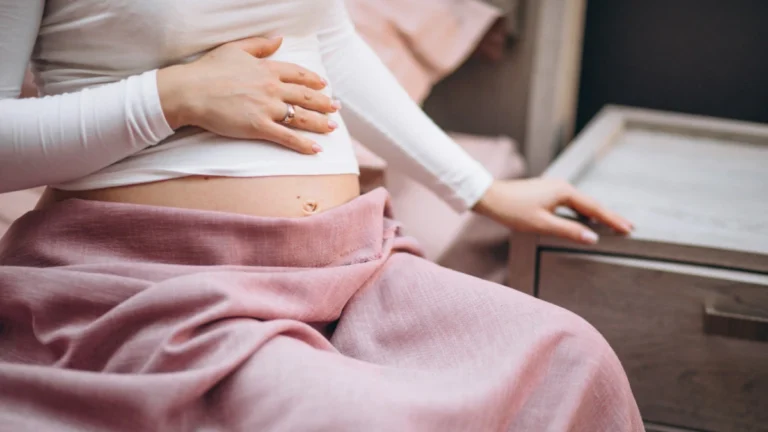 New mother recovering after a C-section with abdominal discomfort from postpartum constipation