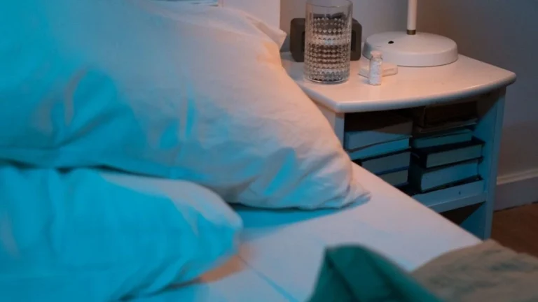 Magnesium and melatonin supplements placed beside a bed for sleep support